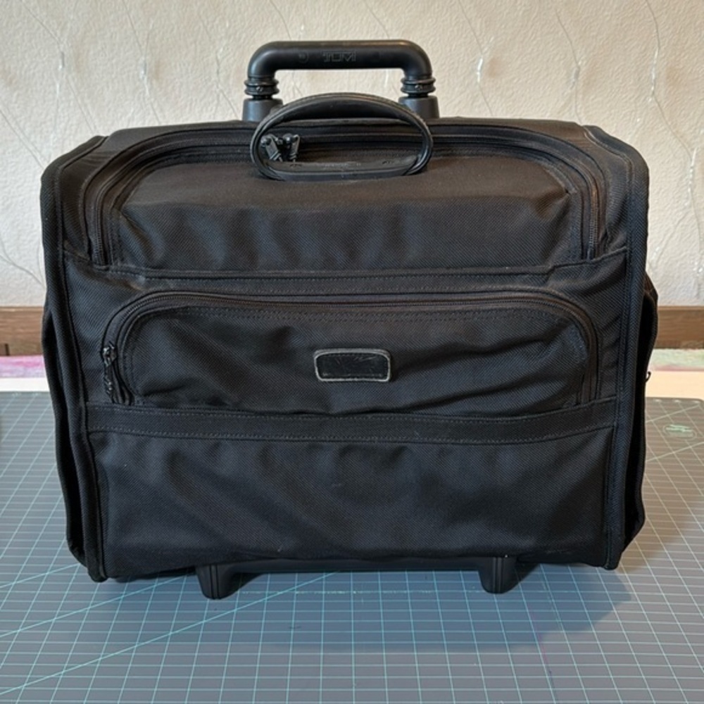 Tumi briefcase suitcase roller. This was so useful for business travel.